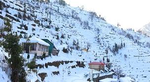 Snowfall in New Tehri town overlooking Tehri Lake
