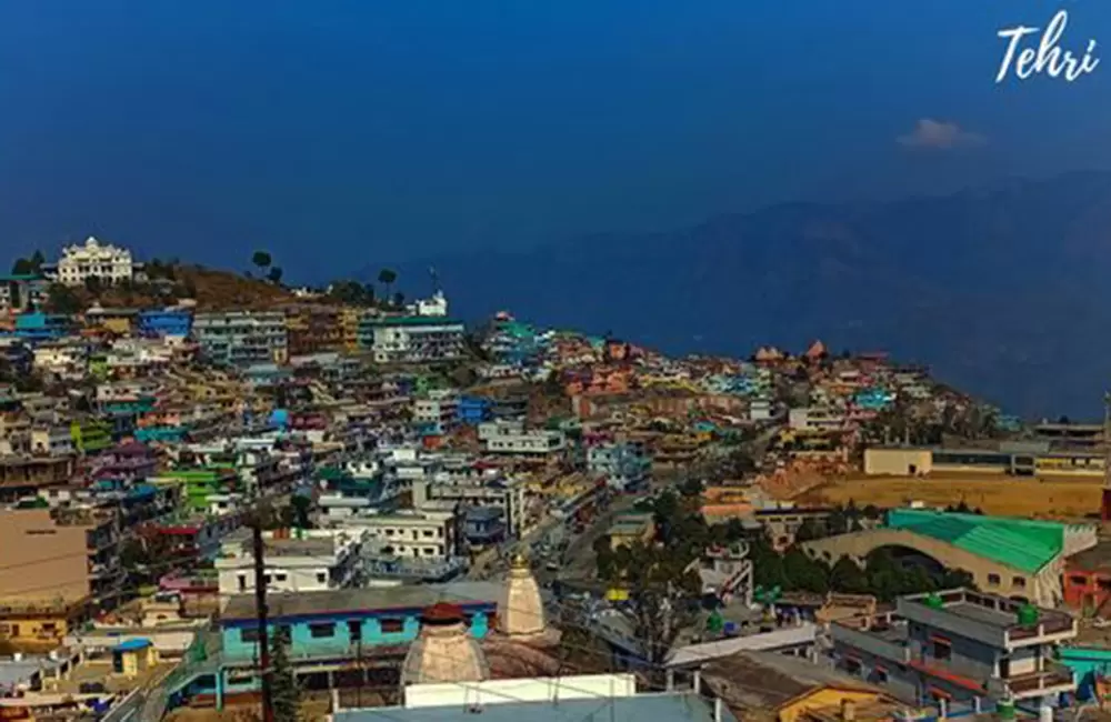 Colourful storefronts and signboards in Baurari market New Tehri