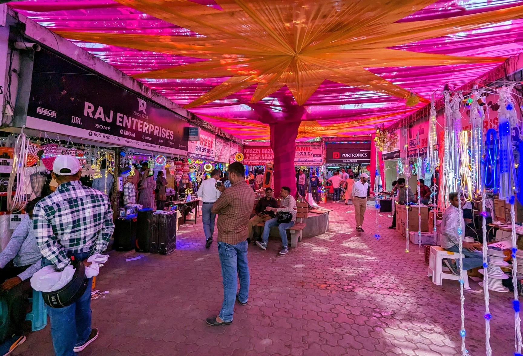 Evening scene with lights and vendors in New Tehri market